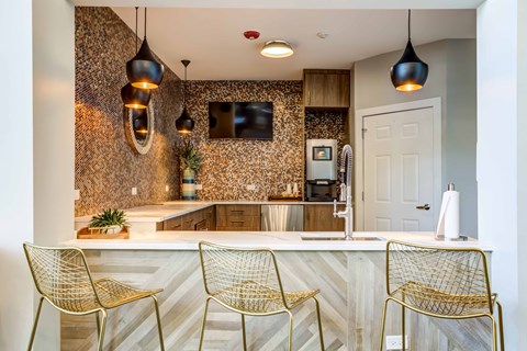 Legacy at Fox Valley On-Site Coffee Station with Bar top Seating, Wrap Around Counters, and Modern Decor